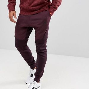 nike tech tapered pants